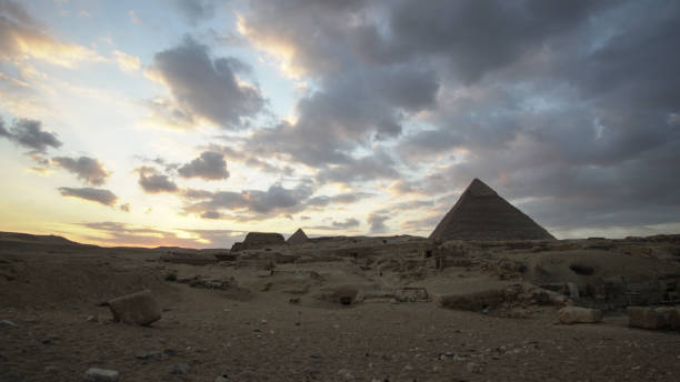 istock Great pyramids of Giza with sphinx panorama view at evening sunset 1399907860