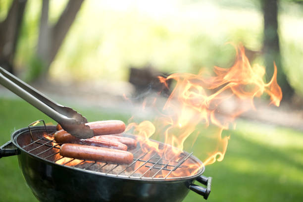 Grilling Hot Dogs and Hamburgers stock photo