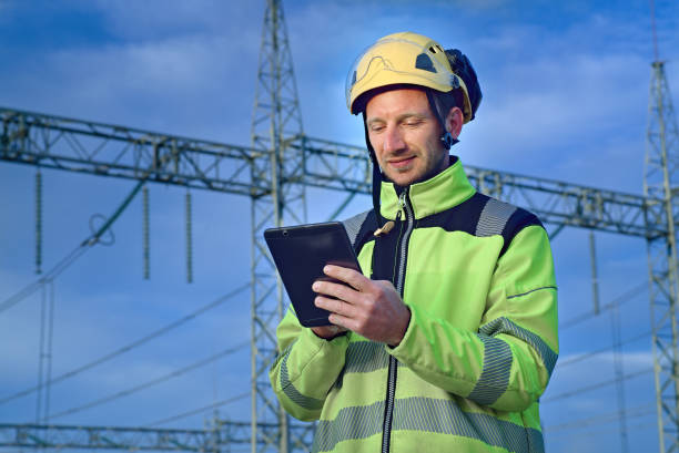 istock Engineer using digital tablet in front of power plant 1399910540
