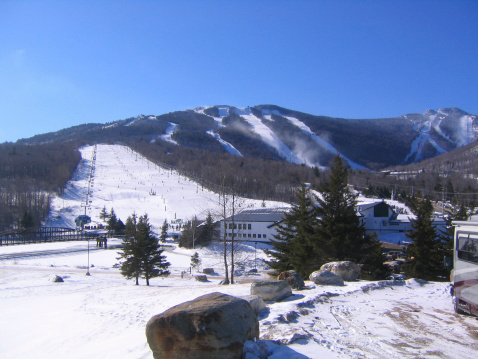 View of the numerous trails taken from the parking lot of a ski resort