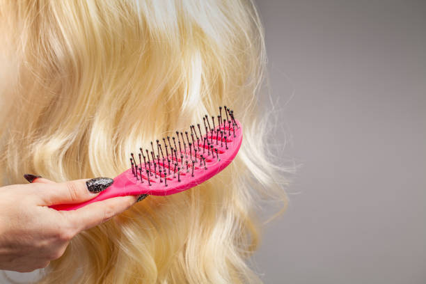 istock Comb suffering from hairloss closeup 1399912650