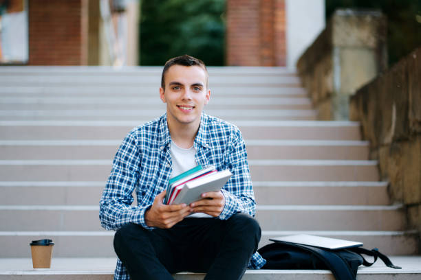 istock Student With Backpack And Books sitting on stairs 1399912892