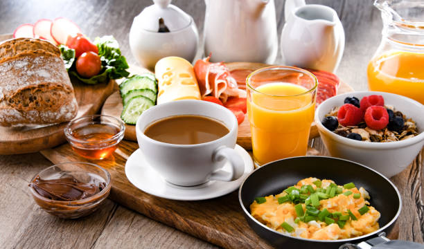 istock Breakfast served with coffee, scrambled eggs, cereals and ham 1399919967