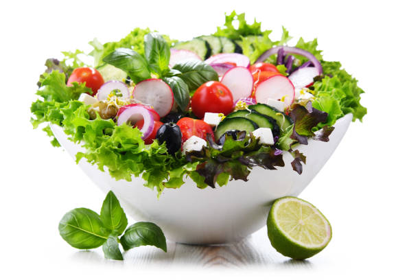 istock Vegetable salad bowl isolated on white background. 1399920073