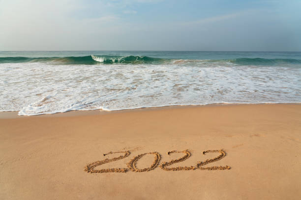 istock Sand beach with 2022 figures, New Year 1399922335