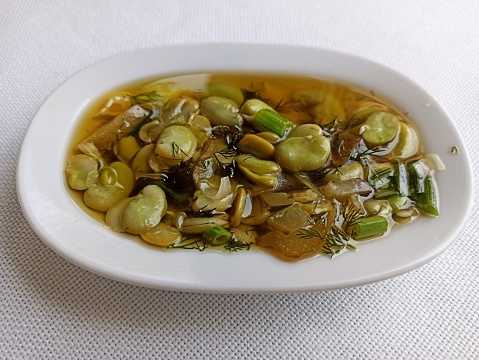 Traditional green and broad bean cooked in olive oil appetizer meze dish at Istanbul turkey