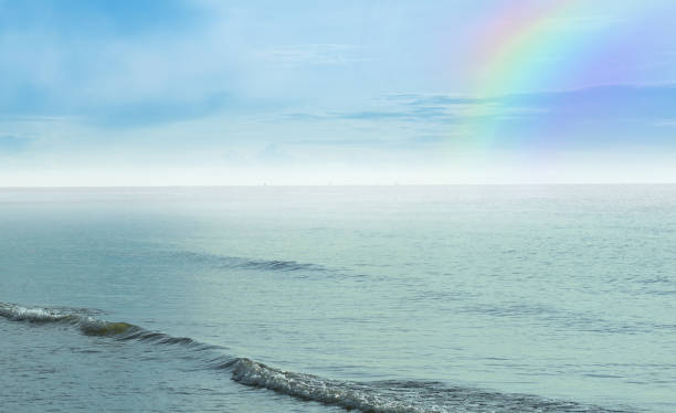 istock beach front sand with blue sky rainbow seascape 1399923863