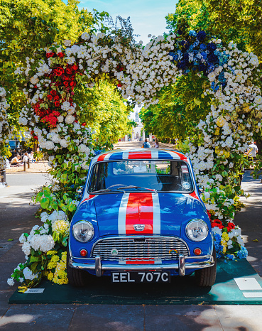 San Antonio, Texas, USA - April 8, 2022: The Battle of the Flowers Parade, Cadillac classic car carries the president of the battle of the flowers association