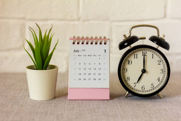 istock Desktop calendar for July 2022 on the table. 1399930178