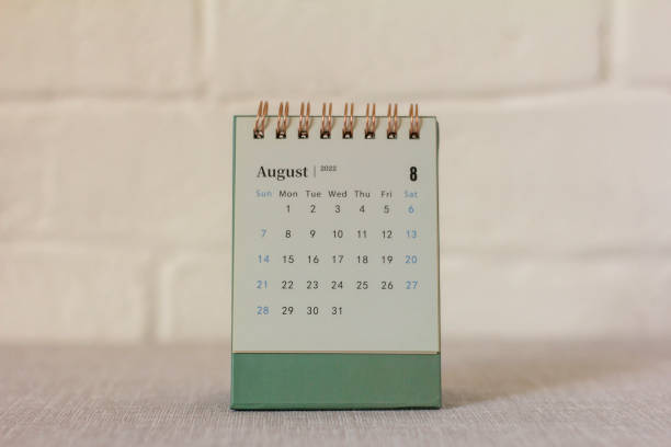 istock Desktop mini calendar for August 2022 on the table. 1399930208