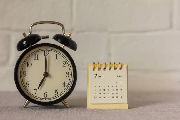 istock Desktop calendar for July 2022 on the table. 1399930282