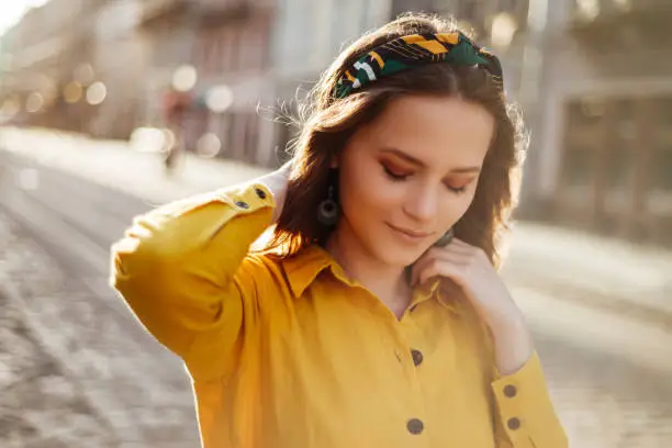 Pretty girl in summer clothes. Young european woman summertime portrait in yellow colours
