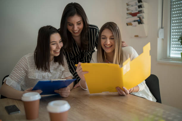 istock Three coworkers discussing new ideas. 1399930420