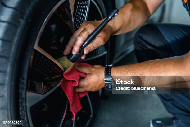 Professional Worker Cleaning Car Rim Stock Photo - Download Image Now - Car Detailing, Car, Cleaning