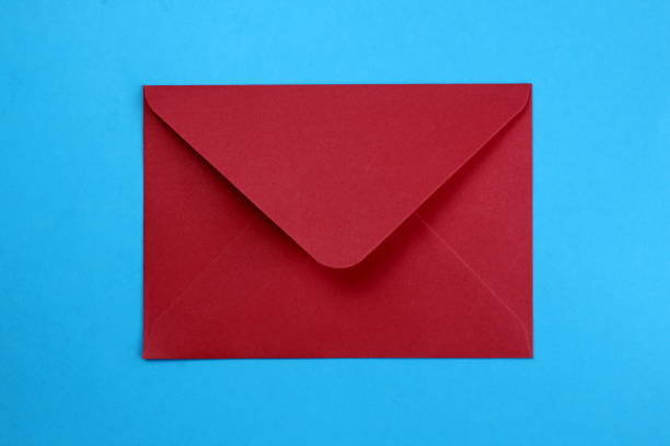istock The red envelope lies on a blue background. 1399934848