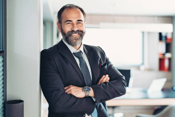 istock Smiling mature businessman in his office 1399935880