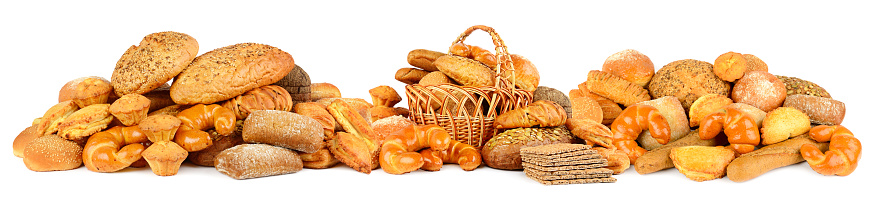 Panoramic photo fresh bread and variety buns isolated on white background.