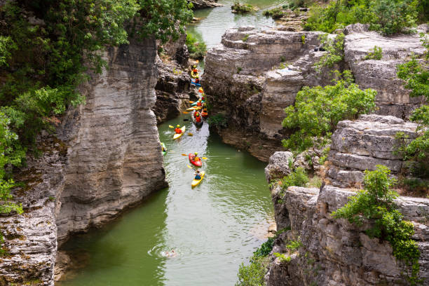 istock Winding river in a scenic canyon with rock and trees 1399938397