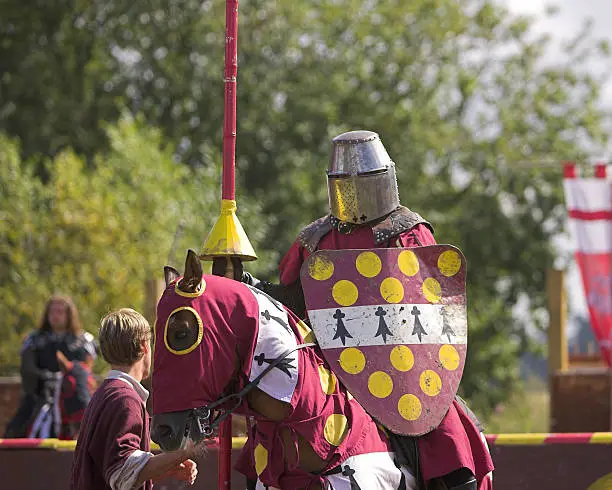 Knights at Warwick castle entertaining the crowds with a jousting spectacle