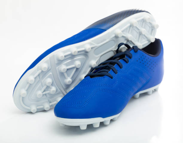 istock Football boots with studs isolated on white background 1399941107