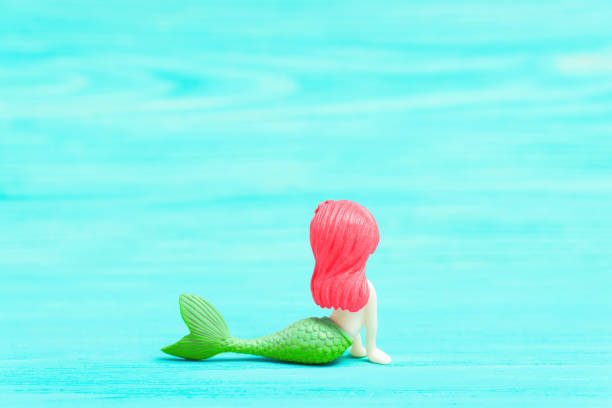 istock Mermaid figurine on a turquoise background 1399942608