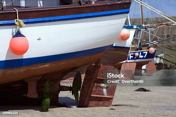 Boat Rudders At Low Tide Stock Photo - Download Image Now - Anchor - Vessel Part, Anchor Chain, Anchored