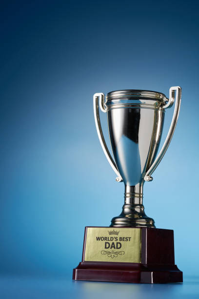 istock world best dad trophy against blue background 1399943305