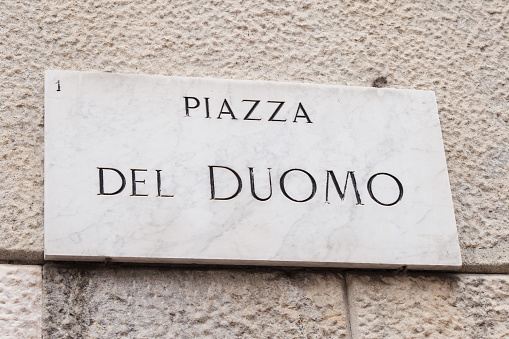 Piazza Del Duomo street sign in Milan historical central square.