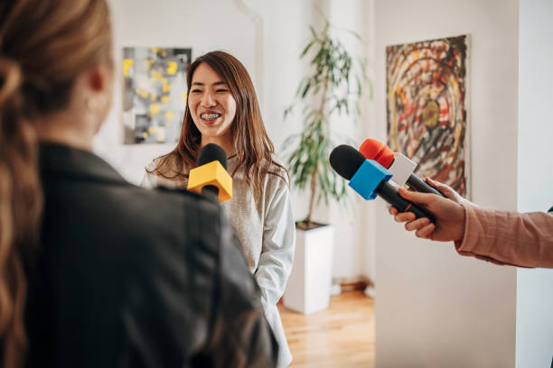 istock Artist talking to the press 1399943408