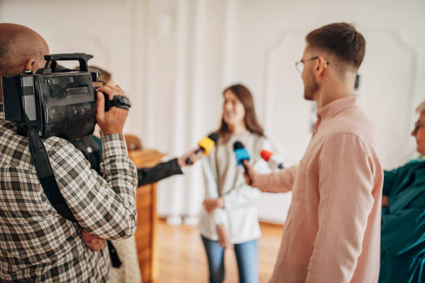 istock Female painter talking to the press 1399943614