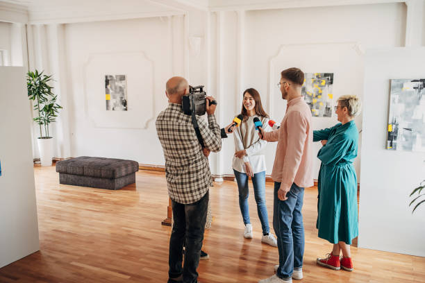 istock Female painter talking to the press 1399943662