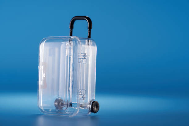 transparent  luggage and blue background