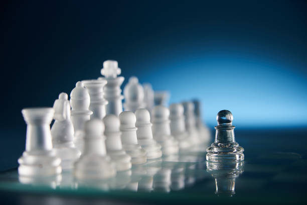 istock glass chess on the chess board against blue background 1399944901