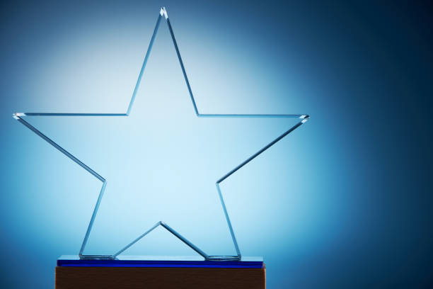istock crystal star shape trophy against blue background 1399944938