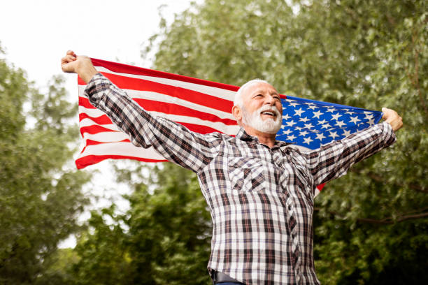 istock Older American holding the USA Flag 1399946917