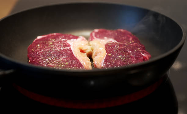 istock Juicy beef tenderloin is cooked in a skillet. 1399947816