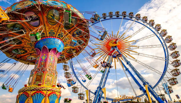 spring festival in munich - germany - amusement park oktoberfest munich chain swing ride imagens e fotografias de stock
