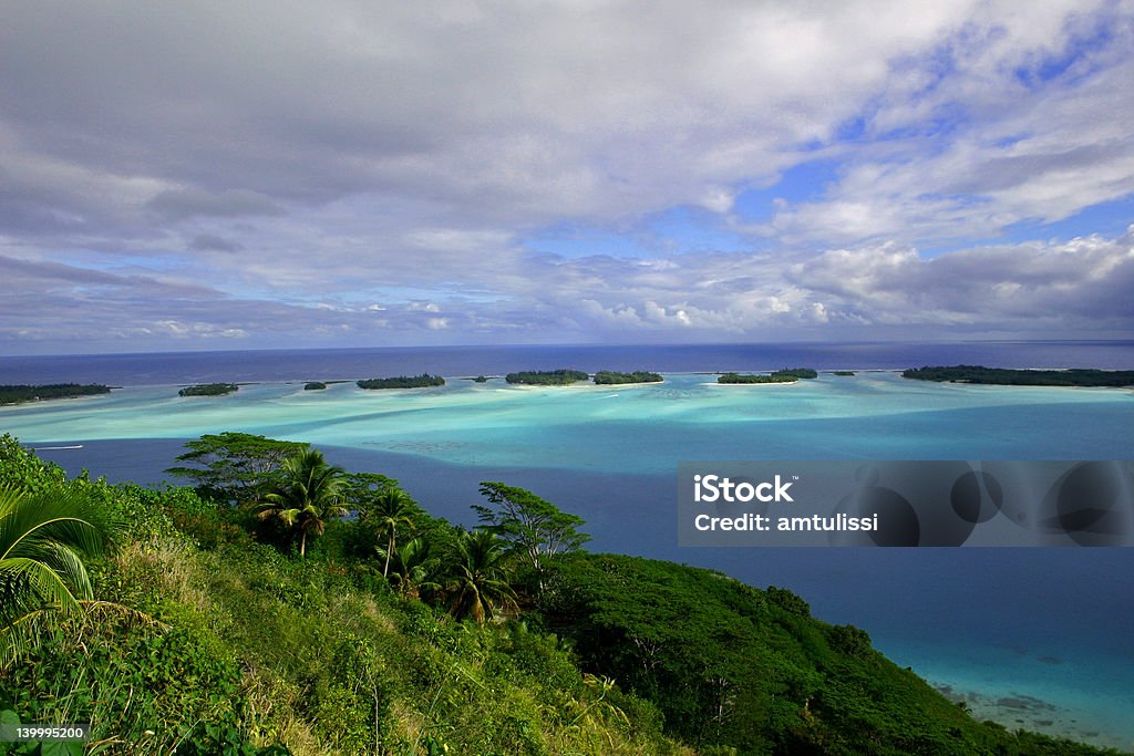Tropical Island A lush island over looking the pacific ocean in French Polynesia. Blue Stock Photo