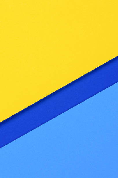 istock Creative abstract blue and yellow color geometric paper composition background, top view 1399953112