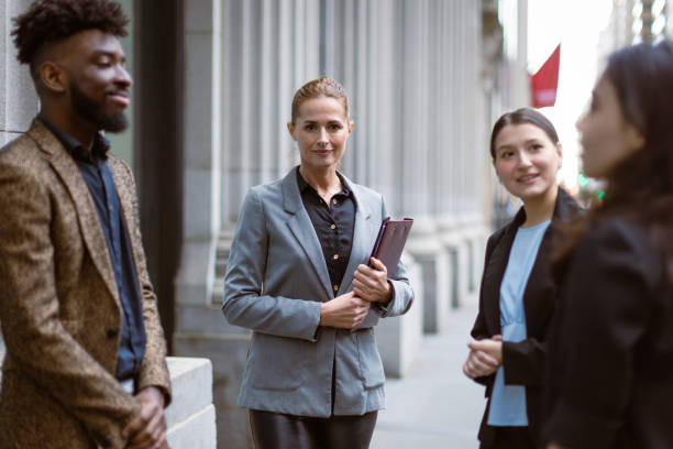 istock Business people talking in front of the office 1399953327