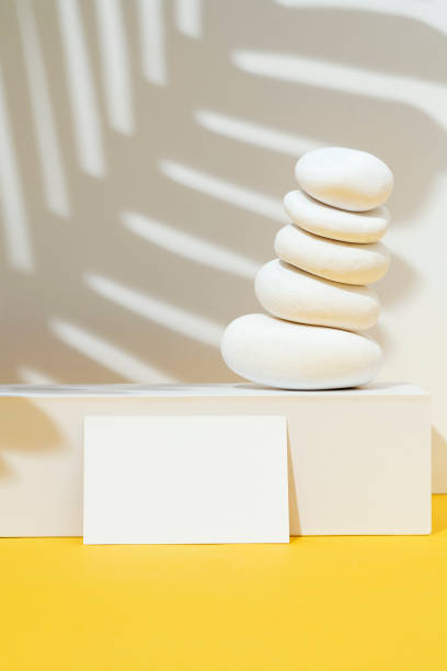 istock Business card mockup, template with white stones, pebble stack 1399956152