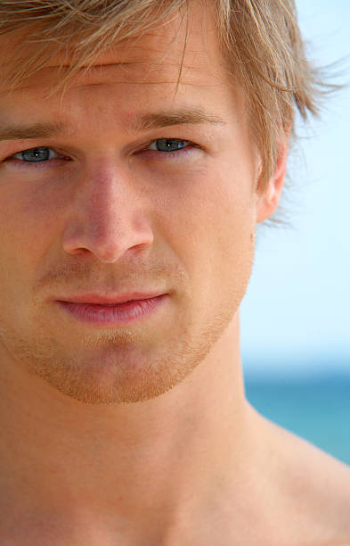 istock Young male model at the beach 139995617