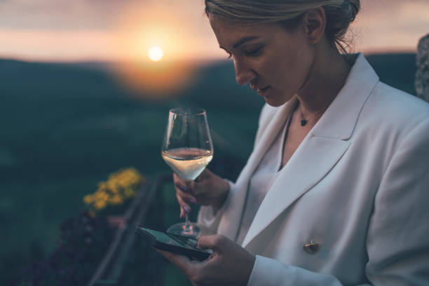 Businesswoman at winery viewpoint stock photo