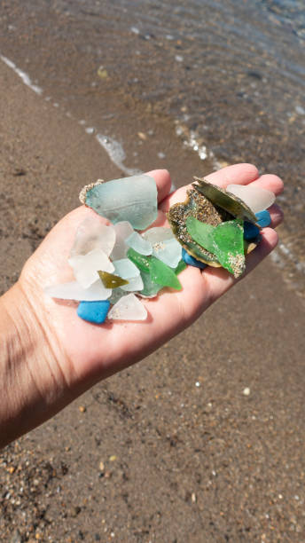 istock Woman hands holding colored crystals and seashells 1399957235