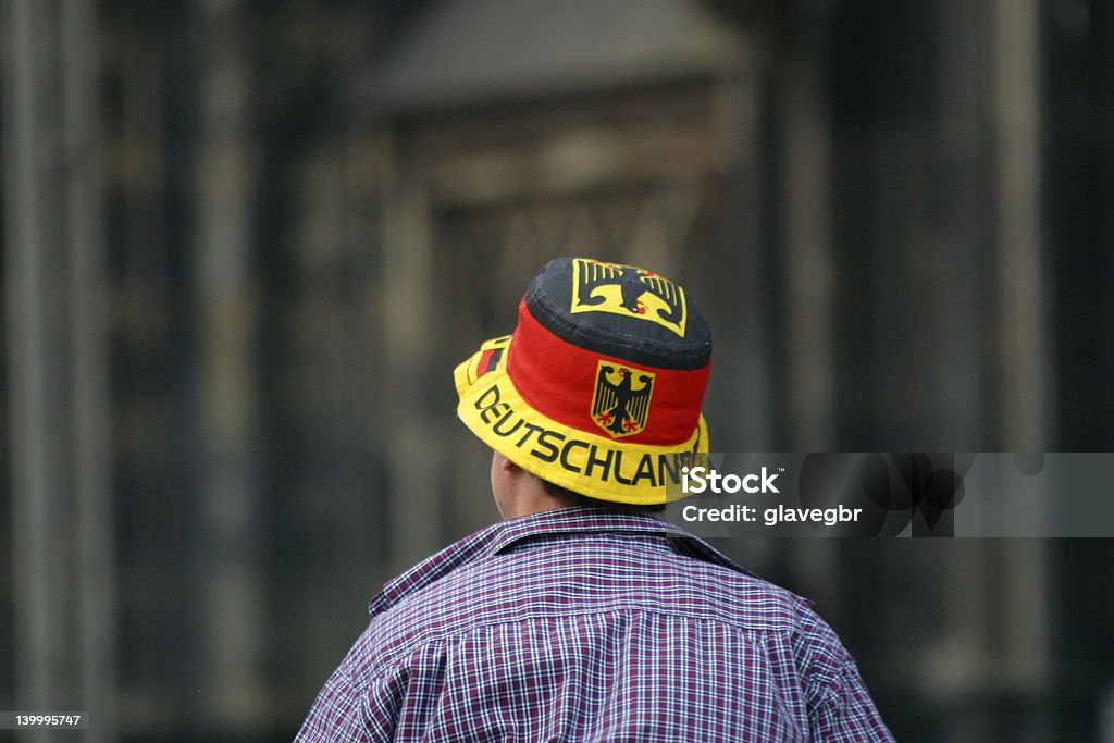 Deutschland - Germany Fan Man wearing a fancy hat with german flag on it in front of cologne cathedral. 2006 Stock Photo