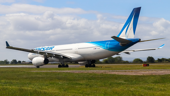 Liverpool Airport, United Kingdom - 27 April, 2022: RARE - Corsair Airbus A330 (F-HJAZ) entering runway 27 for take off to Paris (ORLY), France as Football fan Charter for The UEFA Champions League Final.