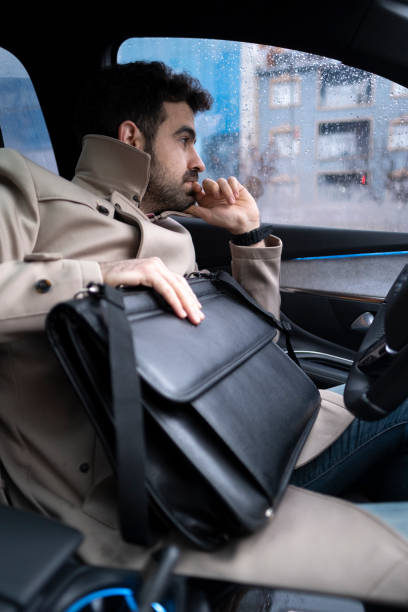 istock Pensive businessman in his car 1399958152