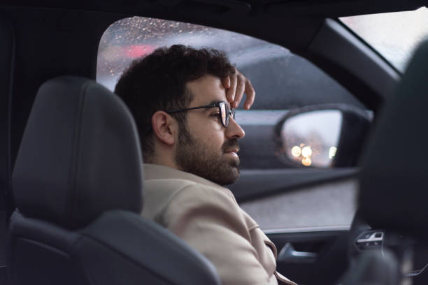 istock Pensive businessman in his car 1399958195