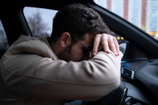 istock Pensive businessman in his car 1399958232