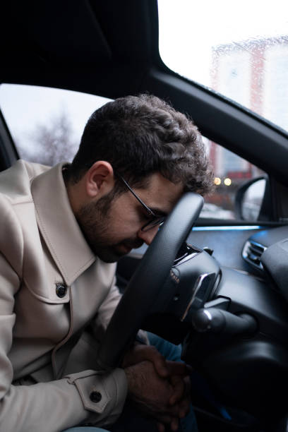 istock Pensive businessman in his car 1399958511